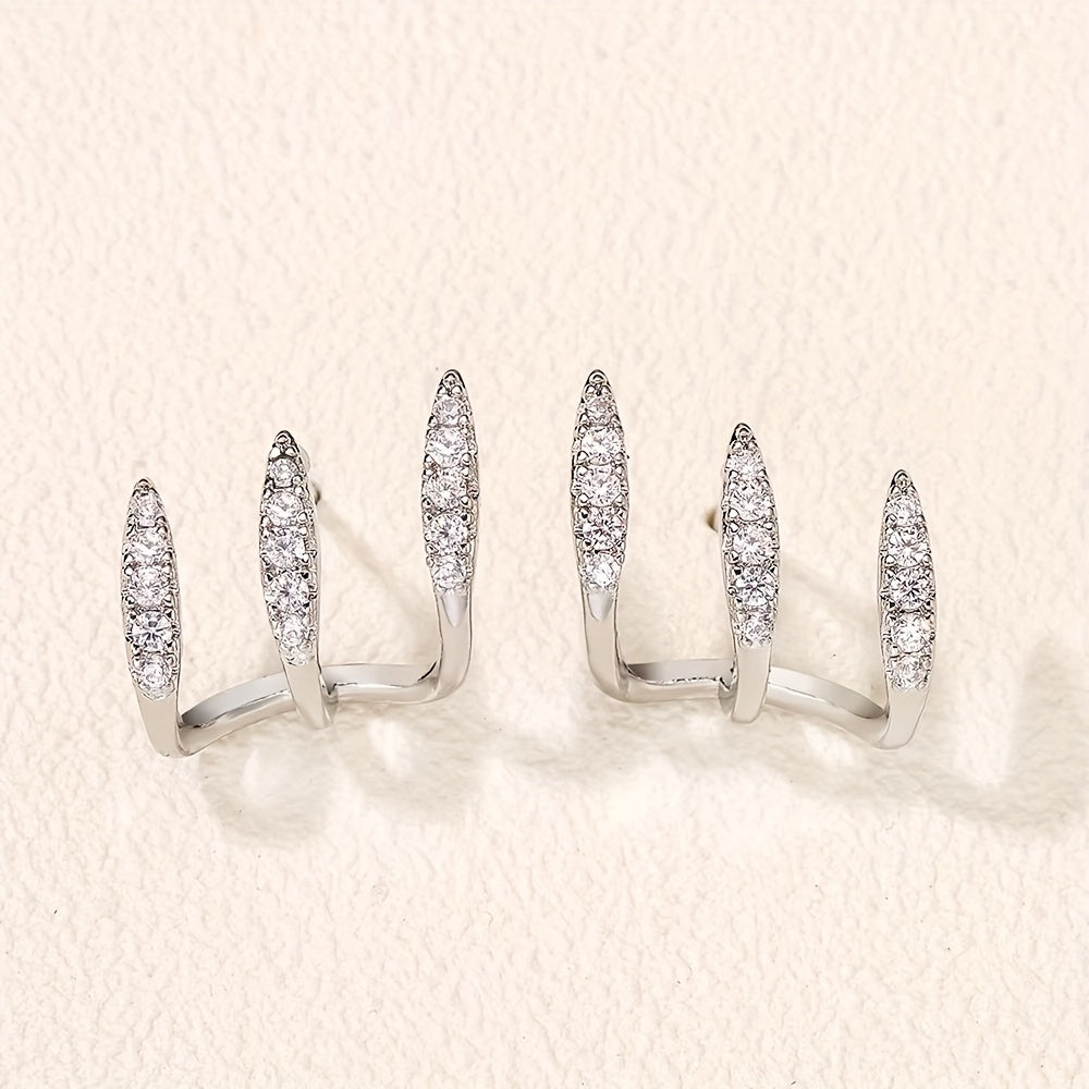 أقراط أنيقة مزينة بالأحجار الكريمة بثلاثة مخالب