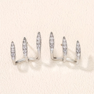 أقراط أنيقة مزينة بالأحجار الكريمة بثلاثة مخالب