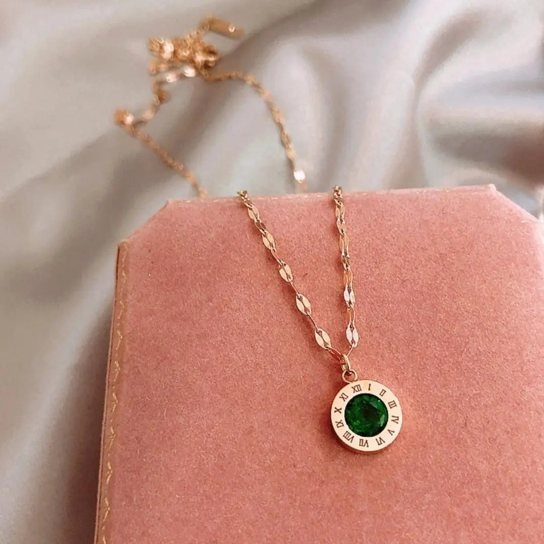 Time necklace with emeralds in gold