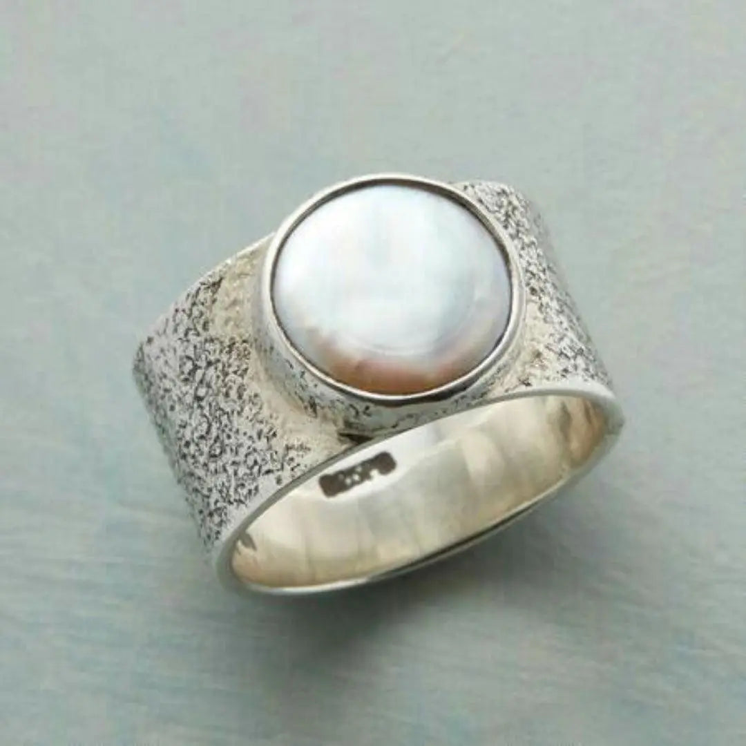 Antique silver ring with a white pearl