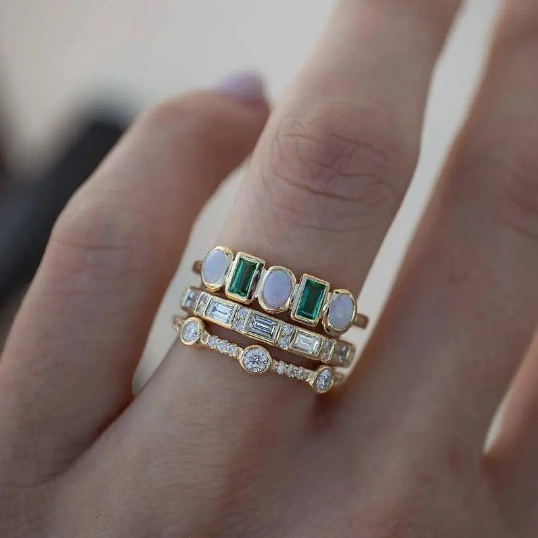 Antique rings with white and green opals 