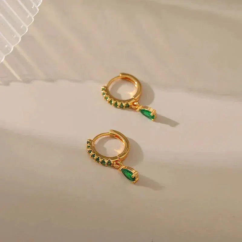 Zirconia earrings with emeralds in gold
