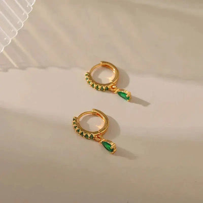 Zirconia earrings with emeralds in gold