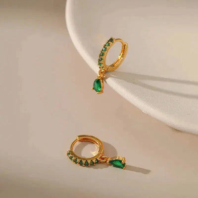 Zirconia earrings with emeralds in gold