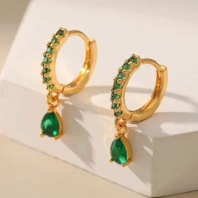 Zirconia earrings with emeralds in gold