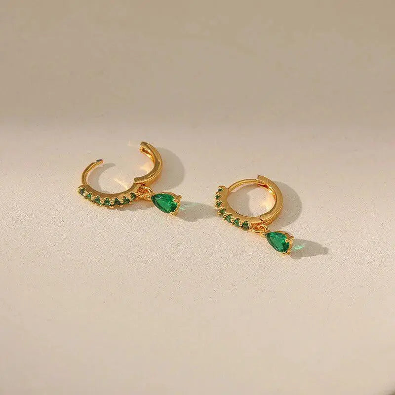 Zirconia earrings with emeralds in gold