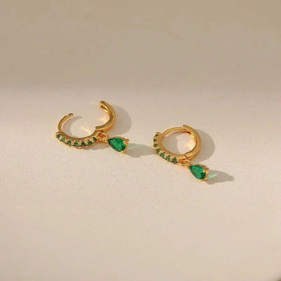Zirconia earrings with emeralds in gold