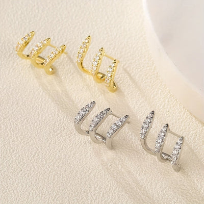 أقراط أنيقة مزينة بالأحجار الكريمة بثلاثة مخالب