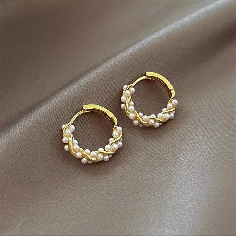 Elegant round pearl earrings with embellishments