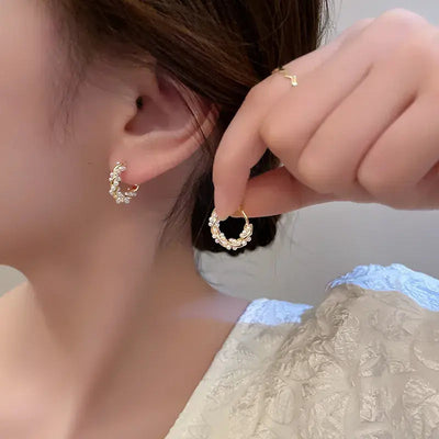 Elegant round pearl earrings with embellishments