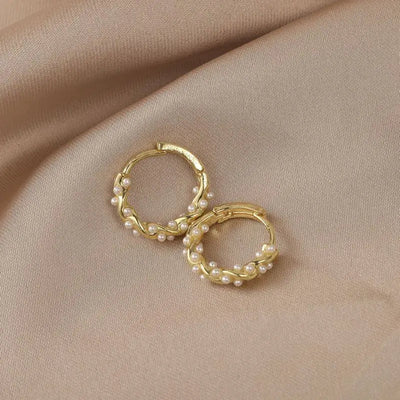 Elegant round pearl earrings with embellishments