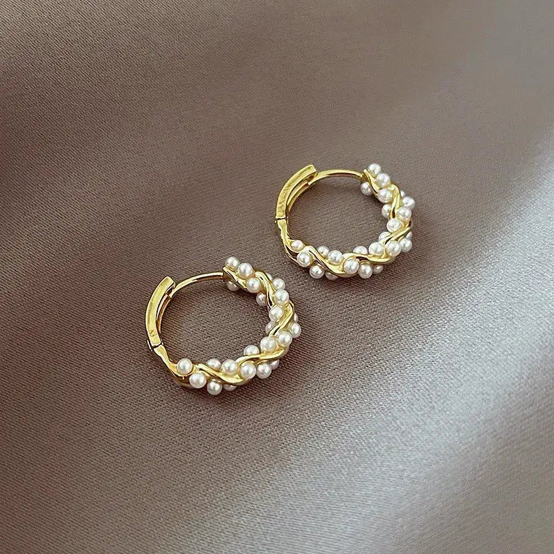 Elegant round pearl earrings with embellishments