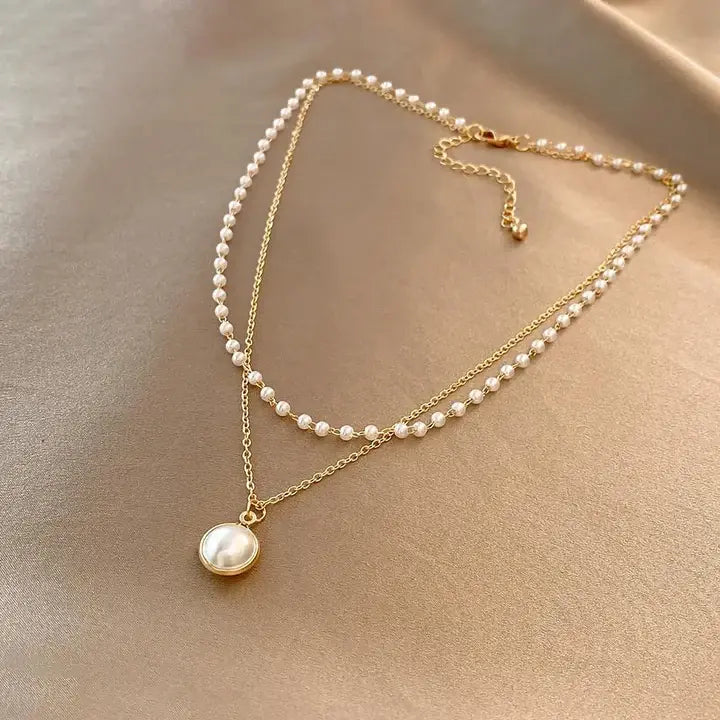 Elegant pearls in a gold necklace
